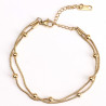 Brazalete de acero inoxidable chapado en oro con forro de perlas